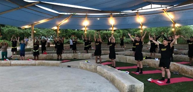 Veterans and military personnel practicing yoga in San Antonio.